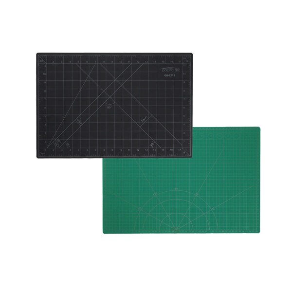 Picture showing both sides of cutting mat, where black has inch rulers and common angles, green side has centimeter rulers on both sides with angles and circles in different sizes.