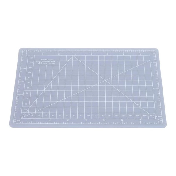 Clear cutting mat with ruler markings on both sides, and a grid pattern throughout with lines representing different angles.