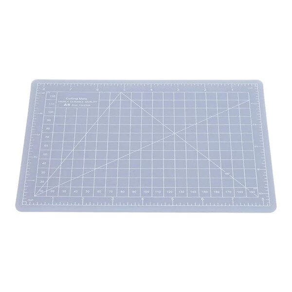 Clear cutting mat with ruler markings on both sides, and a grid pattern throughout with lines representing different angles.