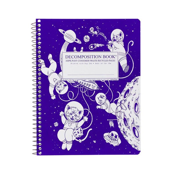 This is a spiral bound composition book. The text on the cover is ultramarine blue. The cover has an ultramarine blue cover with white cats. We see the moon and a rocket ship tethered to the cats.