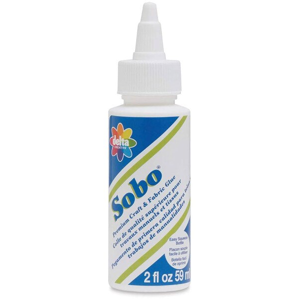 This is a 2oz bottle of craft and fabric glue. The container is mostly white with blue and green accents.