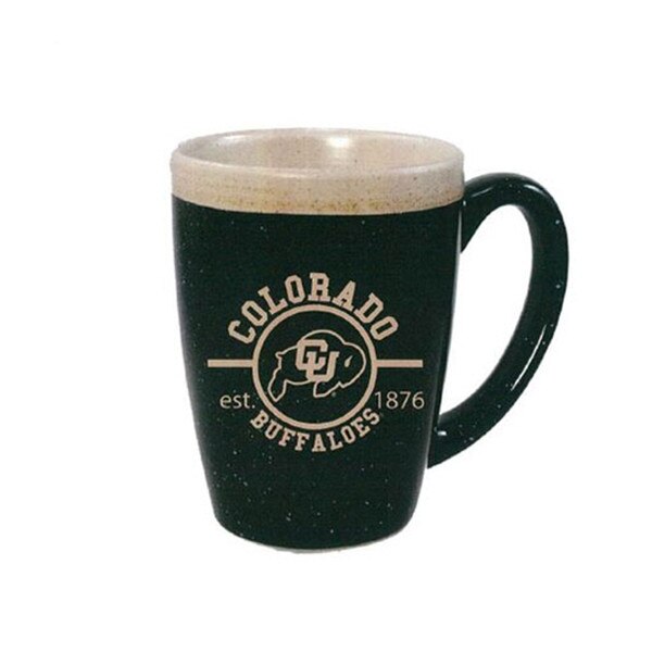 A black paint splatter mug with "Colorado Buffaloes" and "established 1876" in circular Vegas Gold writing and a Vegas Gold CU Buffalo logo, with a cream rippled inside spewing slightly on the top.