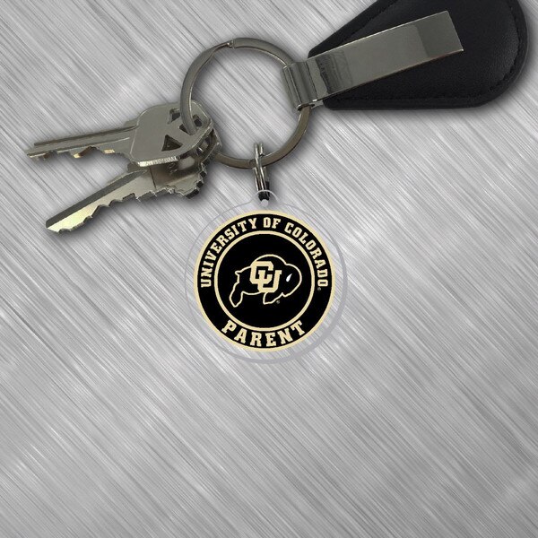 The "University of Colorado Parent" keychain attached to a key ring.
