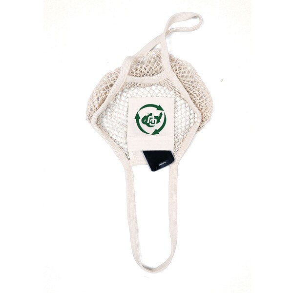 The bag contains a small pocket, perfect for fitting in your cell-phone, and this pocket has a green recycle and CU Buffalo logo on it.