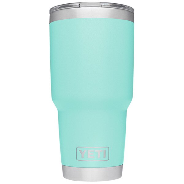 The backside of a mint colored Yeti tumbler with the Yeti logo on the bottom in steel.
