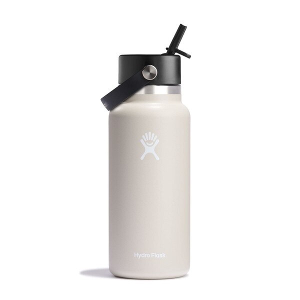 An oatmeal colored 32 ounce stainless steel Hydroflask water bottle with straw lid and handle strap.