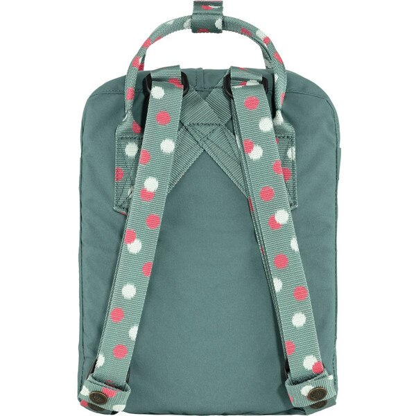 The back of the green Fjallraven mini backpack with white and pink polka dots on the straps.