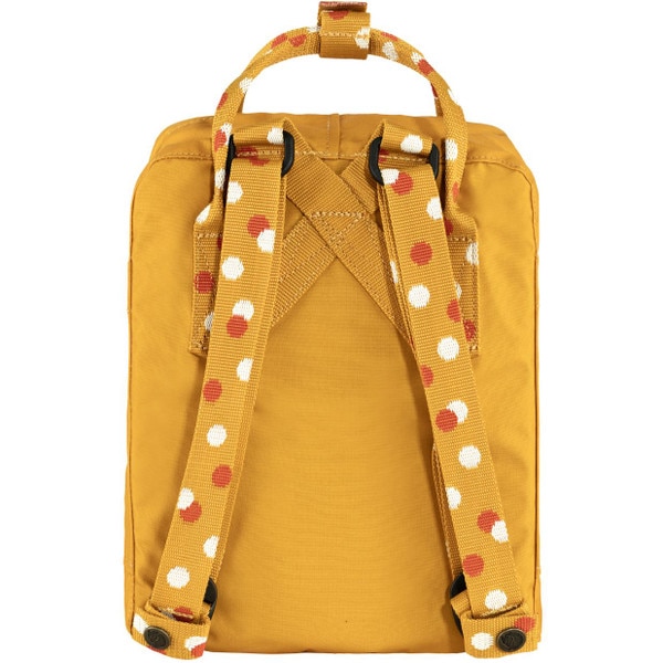 The back of the yellow Fjallraven mini backpack with white and orange polka dots on the straps.