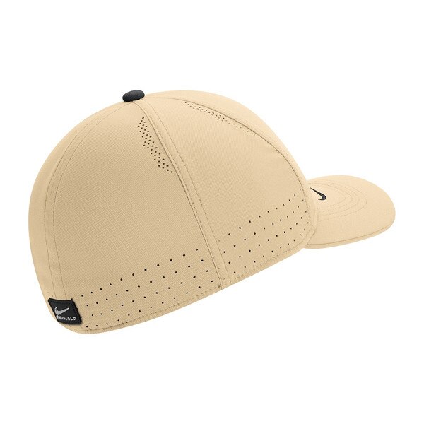 The back of a gold moisture-wicking Nike youth Hat. There is a velcro adjustable strap.
