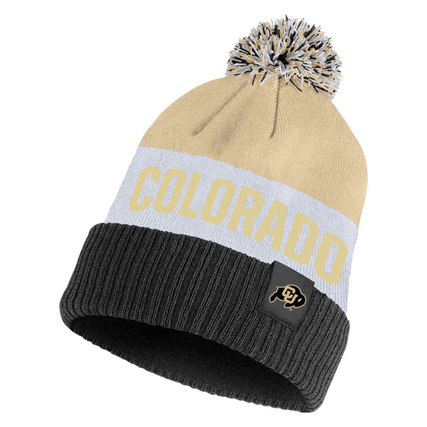 A black, gray, and Vegas Gold color-blocked beanie with a multi-colored pom-pom on top, featuring Colorado in Vegas Gold lettering, and a C-U Buffalo tag on the cuff.