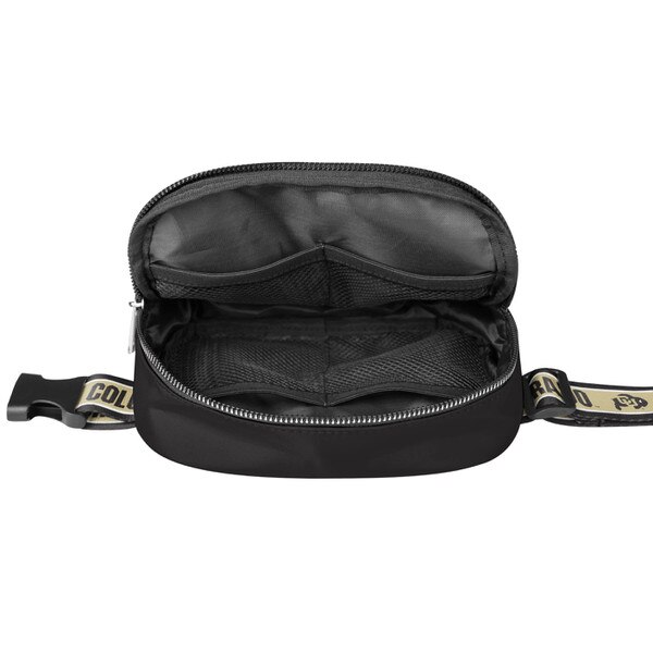 The inside of the black crossbody, with four mesh pockets.