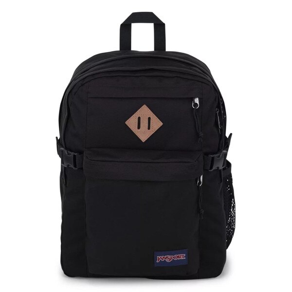 A black jansport backpack with two front pockets and two main compartments, with side mesh pockets, shoulder straps, and a top strap to hold.