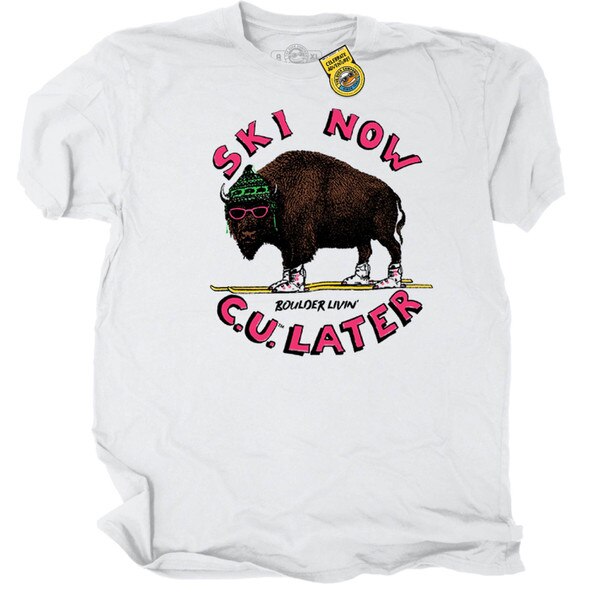 White CU Boulder T-shirt with “Ski Now, C.U. Later” text and Buffalo mascot wearing ski gear, short sleeves and crew neck design