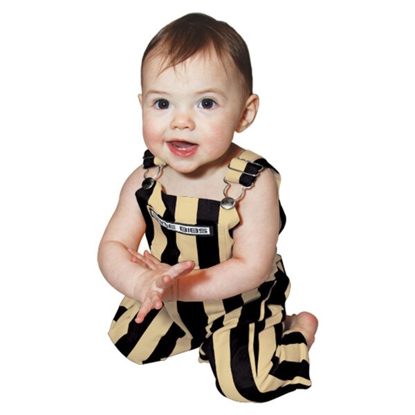This is a pair of full length baby overalls. They are striped black and gold vertically. A very cute baby is modeling them.