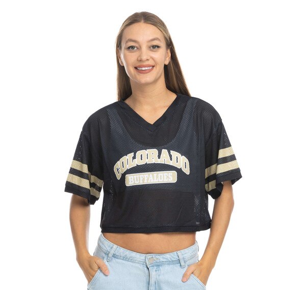 This is a black mesh crop top. Colorado is arched in Vegas gold over a white and gold Buffaloes tag logo. There are two Gold lines encircling each sleeve.