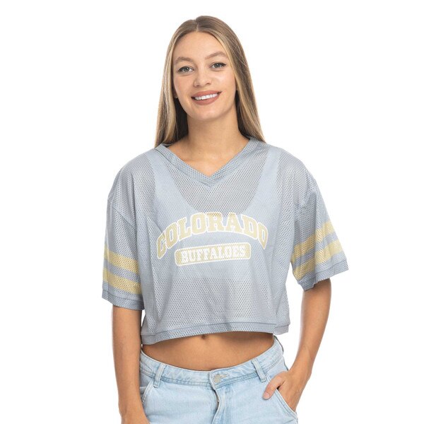 This is a gray mesh crop top. Colorado is arched in Vegas gold over a white and gold Buffaloes tag logo. There are two Gold lines encircling each sleeve.