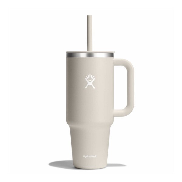 An oatmeal colored, forty ounce tumbler with a handle and the white Hydro Flask logo on the front.