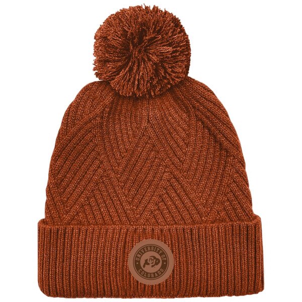 A burnt orange beanie with a matching pom on top. There is a tan circular patch with the CU Buffalo logo and "University of Colorado" written around it.