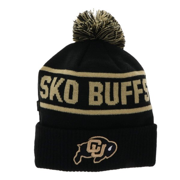 THe Sko Buffs text is gold with medium sized gold lines on top and bottom. The pom and C.U. buffalo logos are black and gold. The base hat is black.