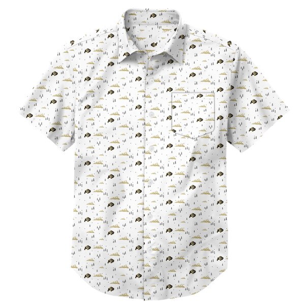 This is a white shirt with a repeating pattern of gold mountains, black and gold CU buffalo logos, and small black evergreen trees. The buttons are a translucent white color.