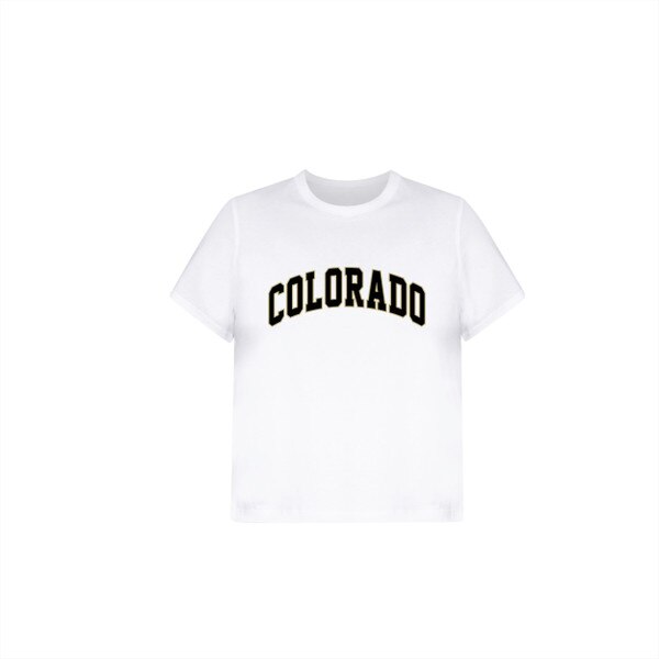 This is a white short sleeve slightly cropped t-shirt. The front has Colorado printed on it in bold block lettering; black framed with a gold border.