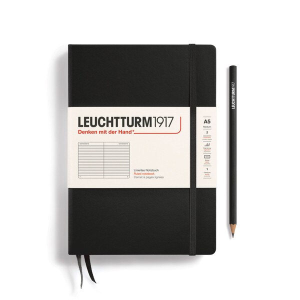 A black colored hardcover notebook.