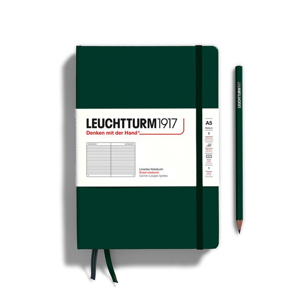 A forest colored hardcover notebook.