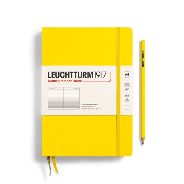A lemon colored hardcover notebook.