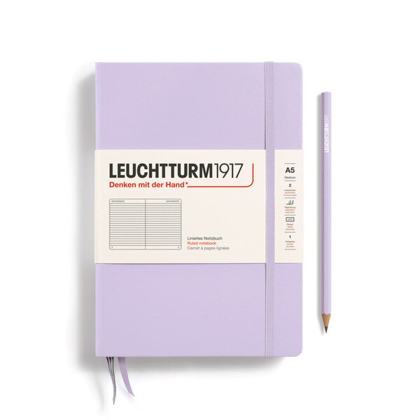 A lilac colored hardcover notebook.
