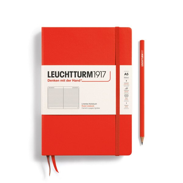 A lobster colored hardcover notebook.
