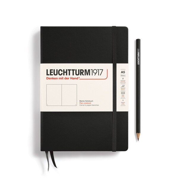 A black colored hardcover notebook.