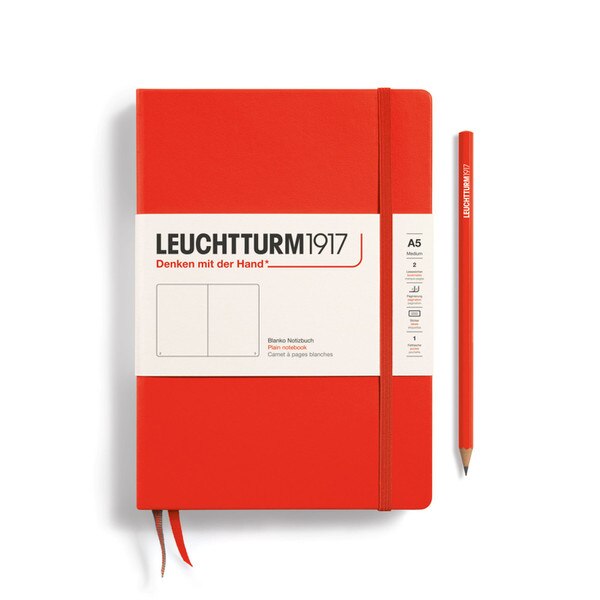 A lobster colored hardcover notebook.