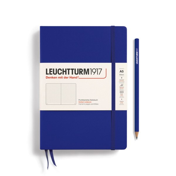 Cobalt blue hardcover dotted notebook with closure strap and two bookmarks.