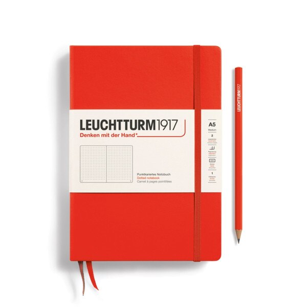 Lobster red hardcover dotted notebook with closure strap and two bookmarks.