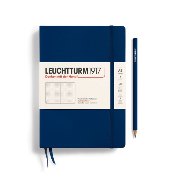 Navy blue hardcover dotted notebook with closure strap and two bookmarks.