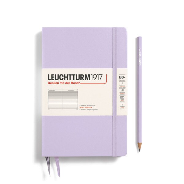Lilac hardcover ruled notebook with 2 bookmarks, with thin fabric strap closure.