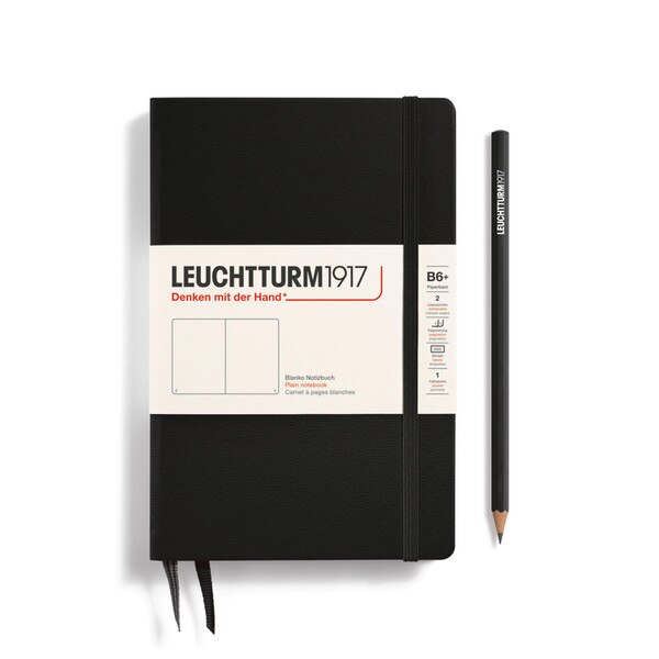 Black hardcover blank notebook with 2 bookmarks, with thin fabric strap closure.