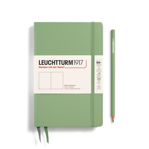 Sage green hardcover blank notebook with 2 bookmarks, with thin fabric strap closure.