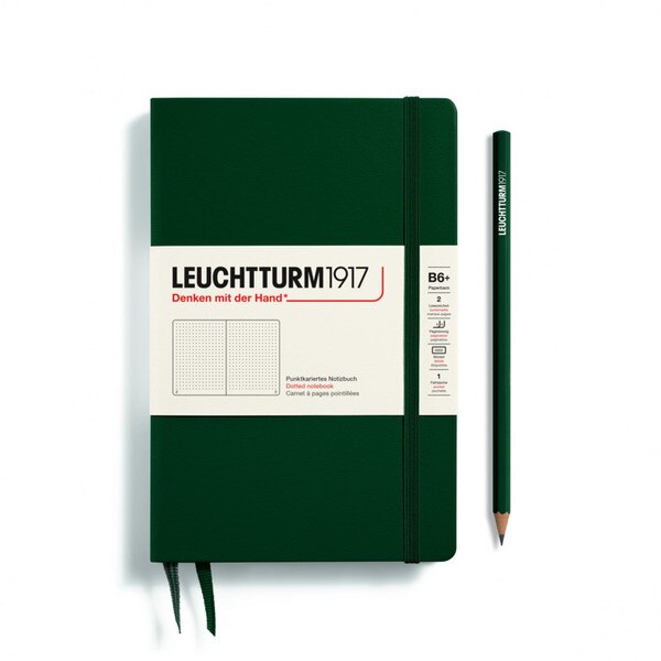 A forest notebook with an elastic to keep it closed.