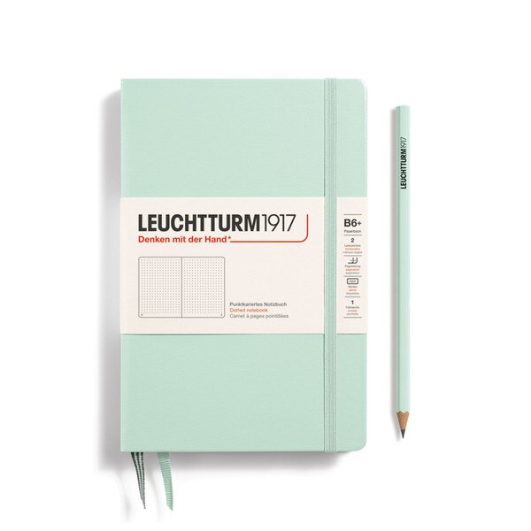 A mint notebook with an elastic to keep it closed.