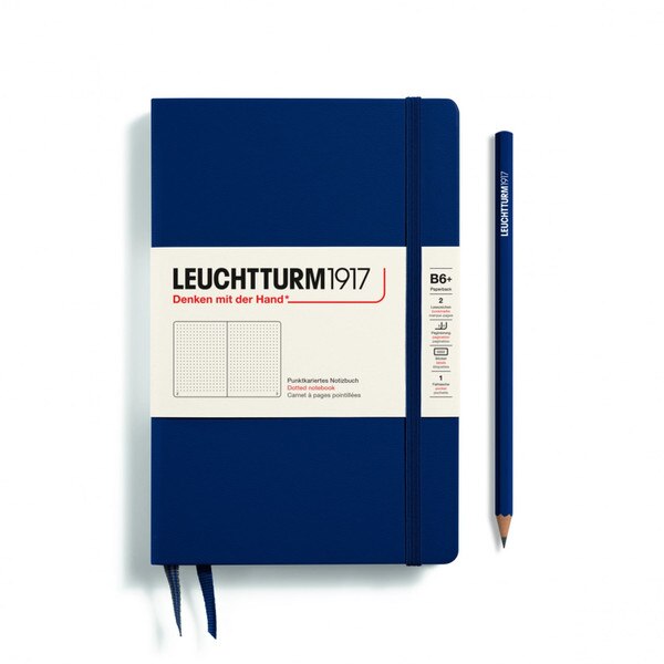 A navy notebook with an elastic to keep it closed.