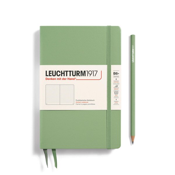 A sage notebook with an elastic to keep it closed.