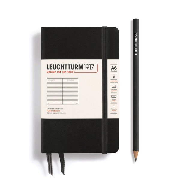 A black hardcover notebook with an elastic to keep it closed.