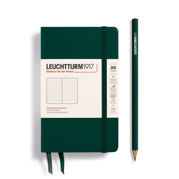 A small, forest notebook with an elastic.