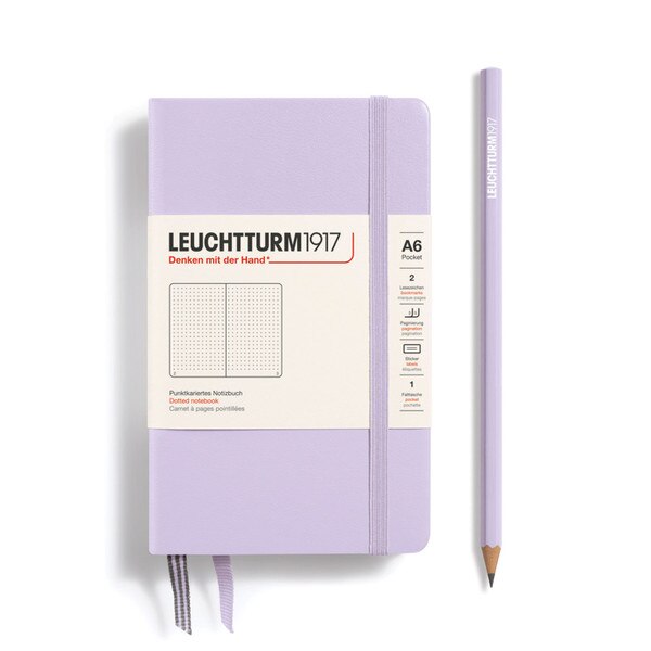 A small, lilac notebook with an elastic.