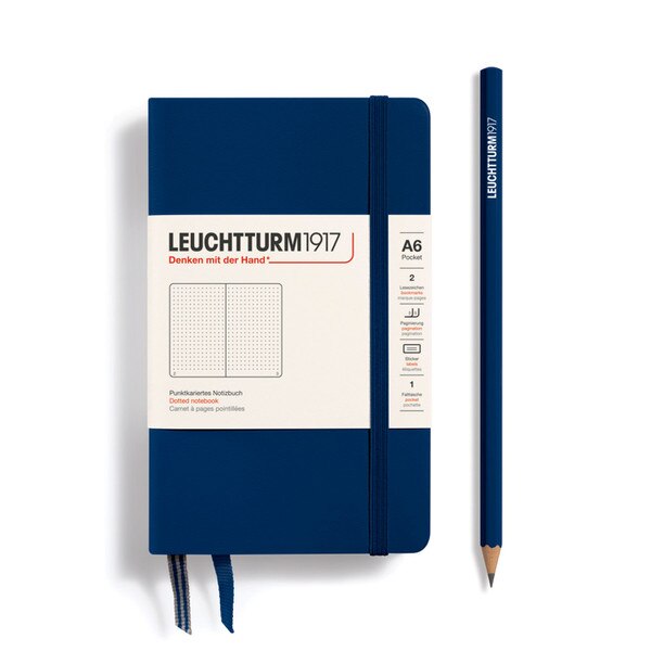 A small, navy notebook with an elastic.