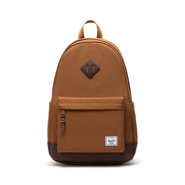 Brown backpack with dark brown leather accents on center and bottom, with Herschel logo patch on small zipper pocket.