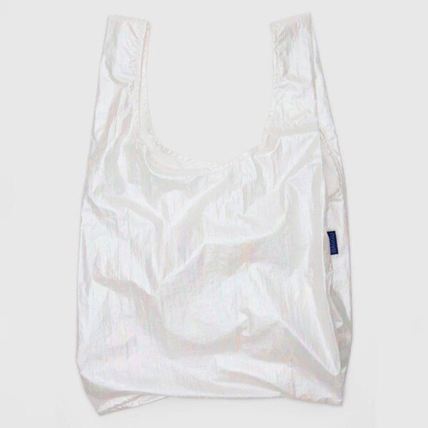 Iridescent white reusable BAGGU bag with subtle rainbow sheen and blue logo tag