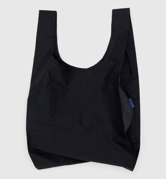 Black reusable BAGGU bag with solid color design and blue logo tag