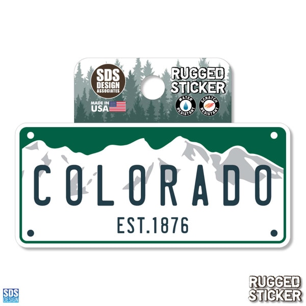 Colorado rugged sticker in the style of a license plate with mountain graphic and "EST. 1876" text.